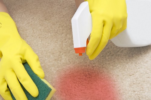 Carpet cleaning team preparing equipment safely before work