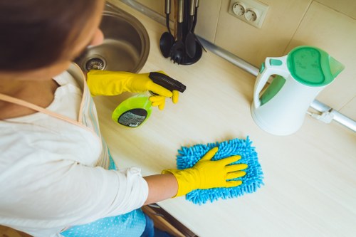 Local cleaner treating stains on a sofa in Waterloo