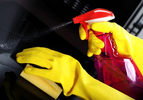 Technician treating stains on a sofa during upholstery cleaning